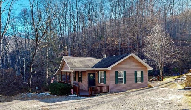 Mountain view home with a fireplace with beautiful view of the creek
