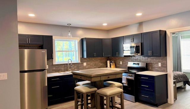 Pristine upscale 2 bedroom duplex unit surrounded by forest.